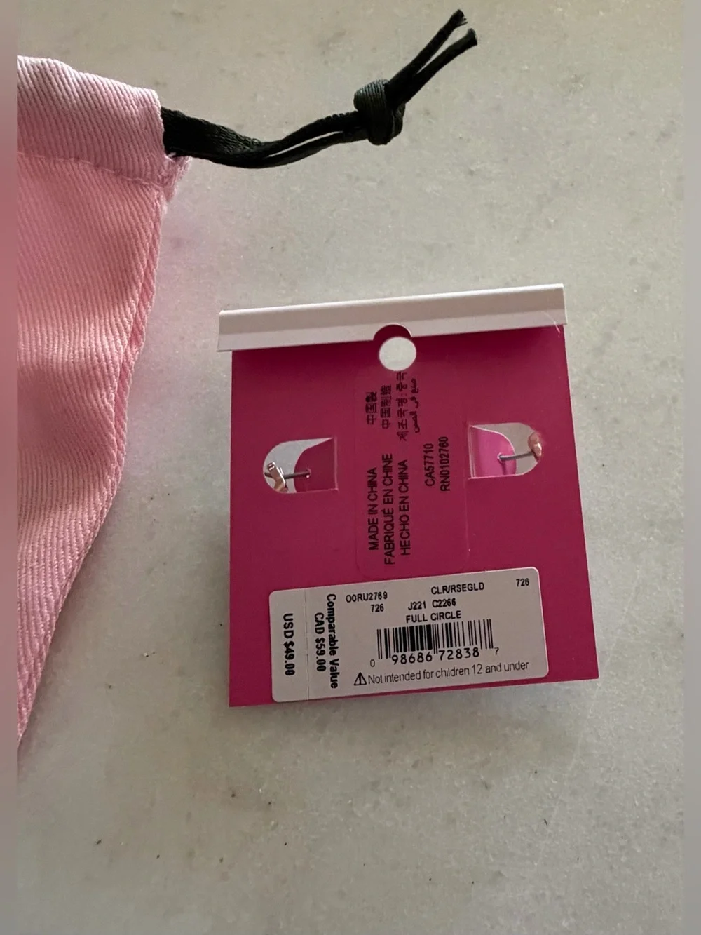 kate spade Pink Drawstring Pouch with Gold Hoop Earrings